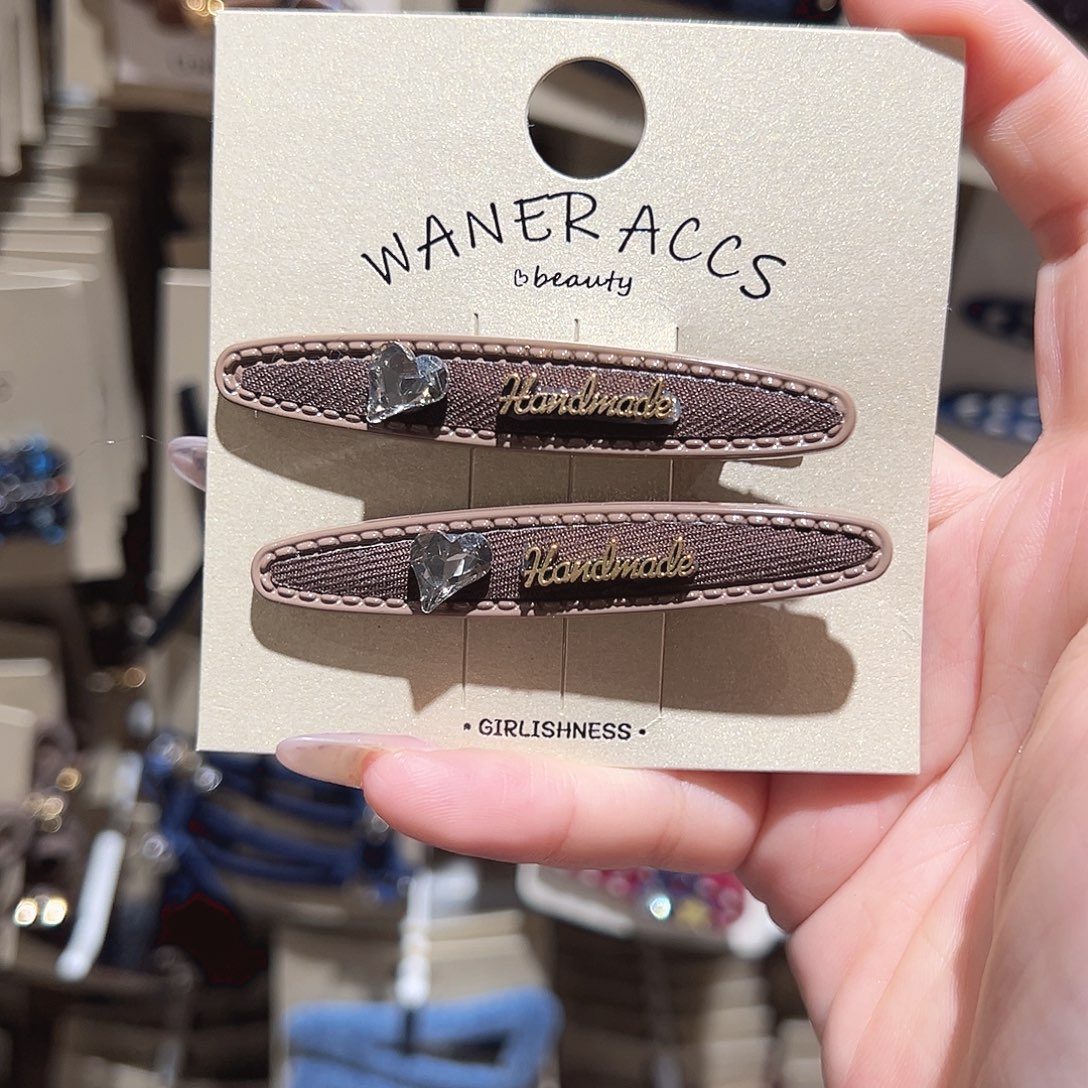 仿珍珠非金属爱心钻咖色鸭夹