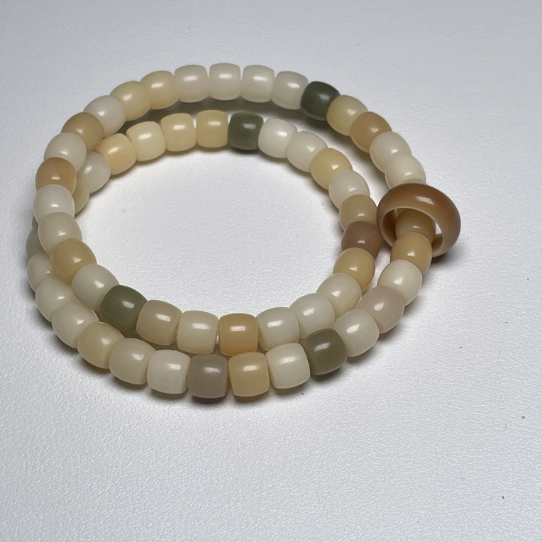 温润如玉多彩斑斓菩提根老型8乘7mm双圈58颗