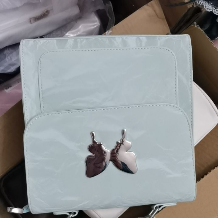 挂脖款蝴蝶结绿色包