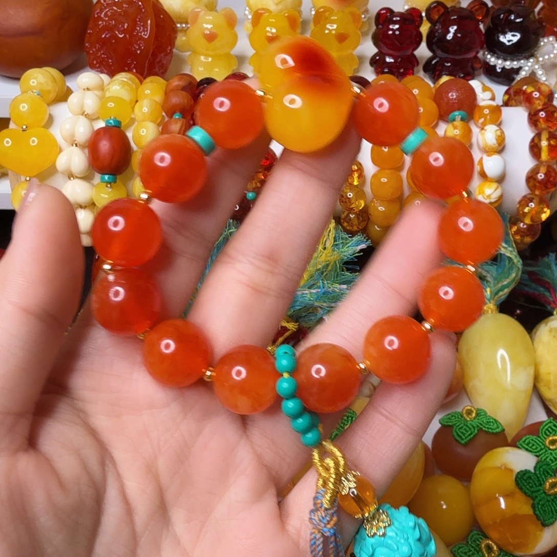 吐***泡非金属蜜糖红手串一