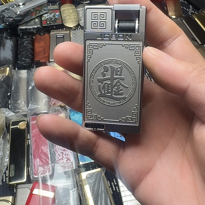 邓***军日进斗金防风充气打火机