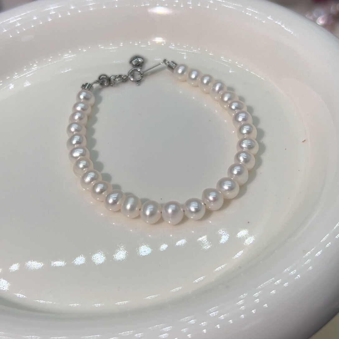 5.5左右近圆天然珍珠钛钢淡水珍珠