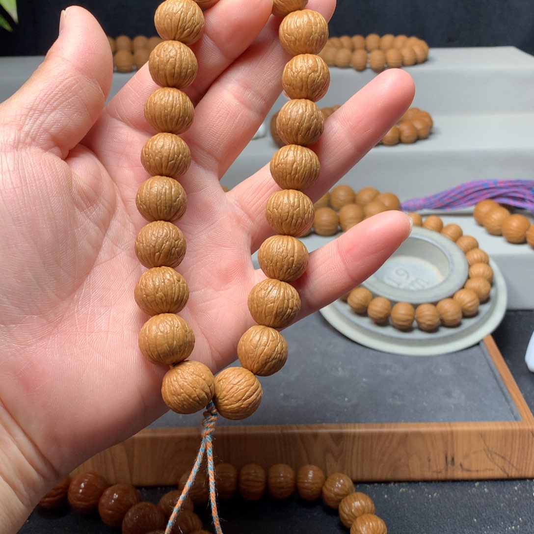 猴头核桃手串凤羽手持