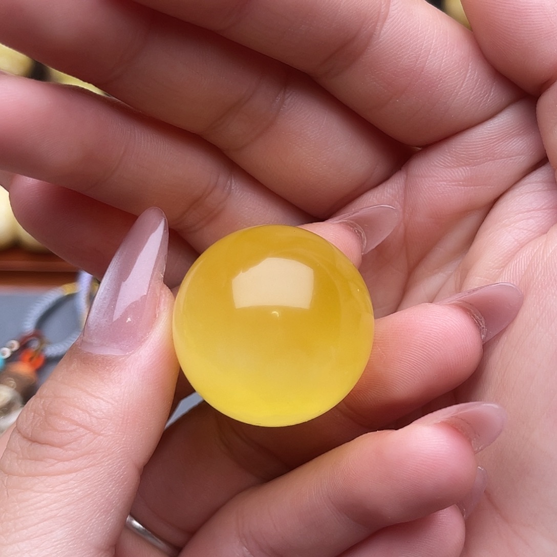 忱***琥珀未镶嵌裸石蜜蜡圆珠梦