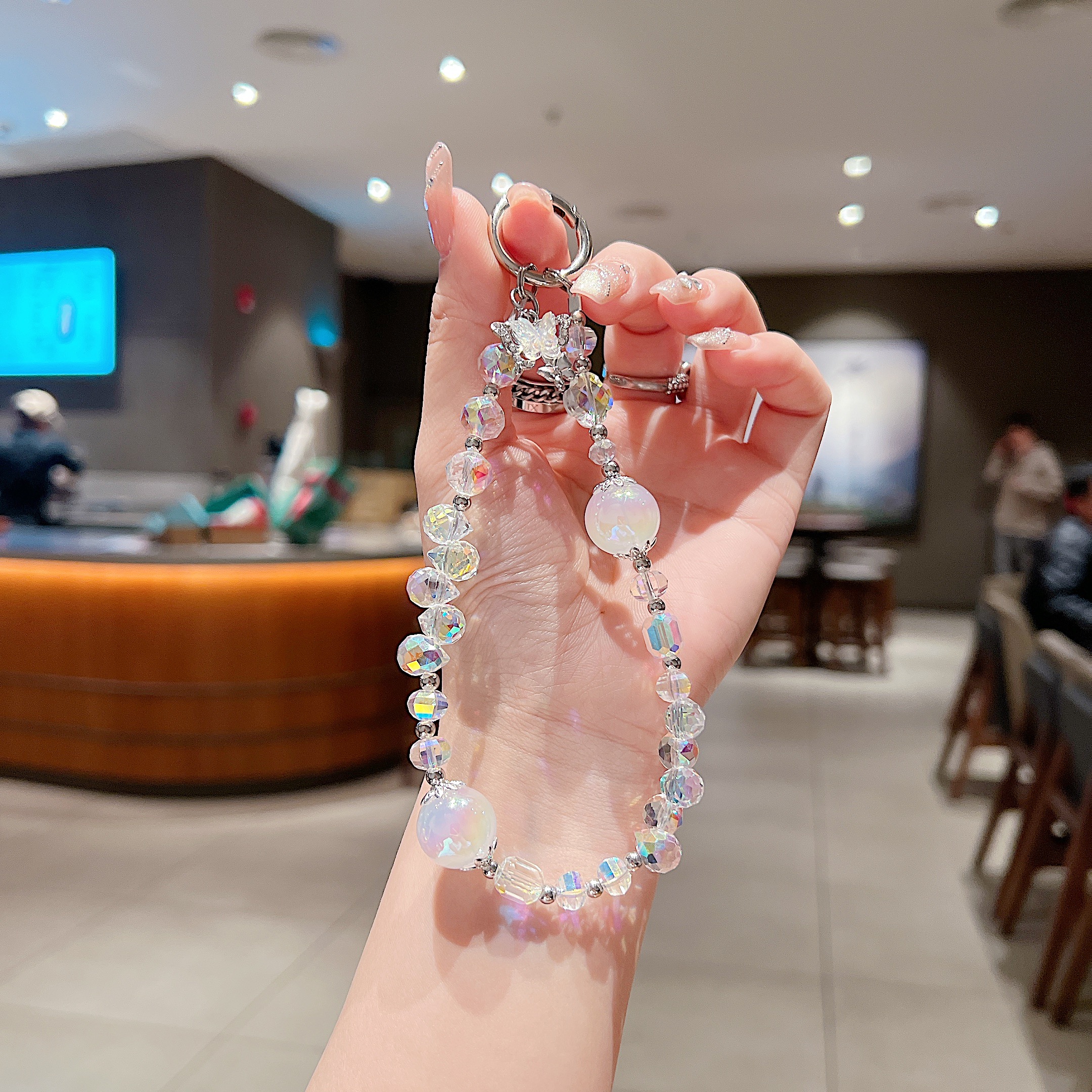 水滴圆球手机手机链女款精品手工水滴梦幻爆闪珠手机链防丢手提链