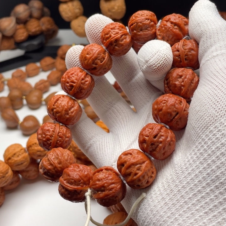 愤***鸟文玩核桃吊坠小核桃手串红皮磨