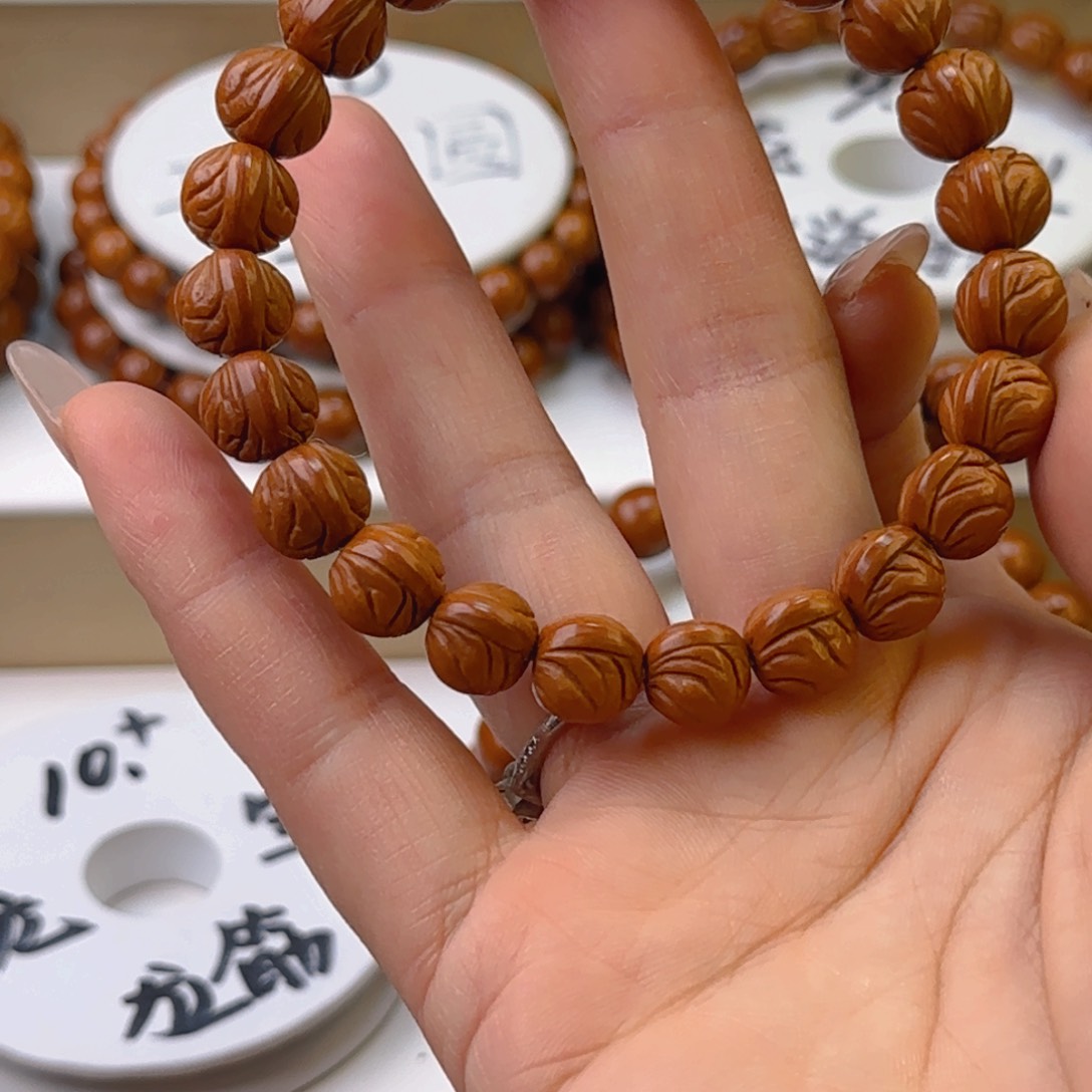 桃核手串z****z龙纹桃核原皮元宝