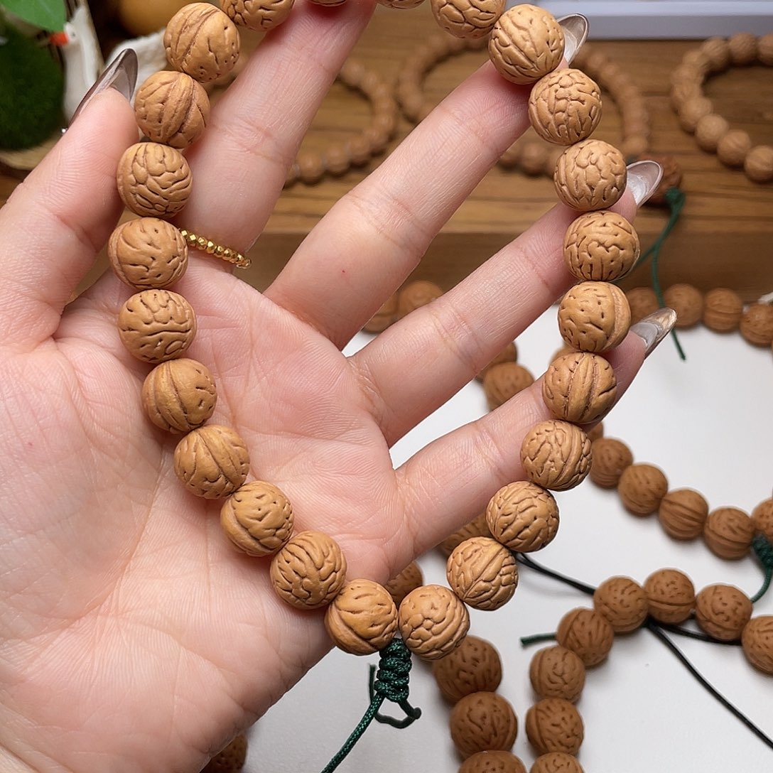 12加野生大肠纹桃核手持