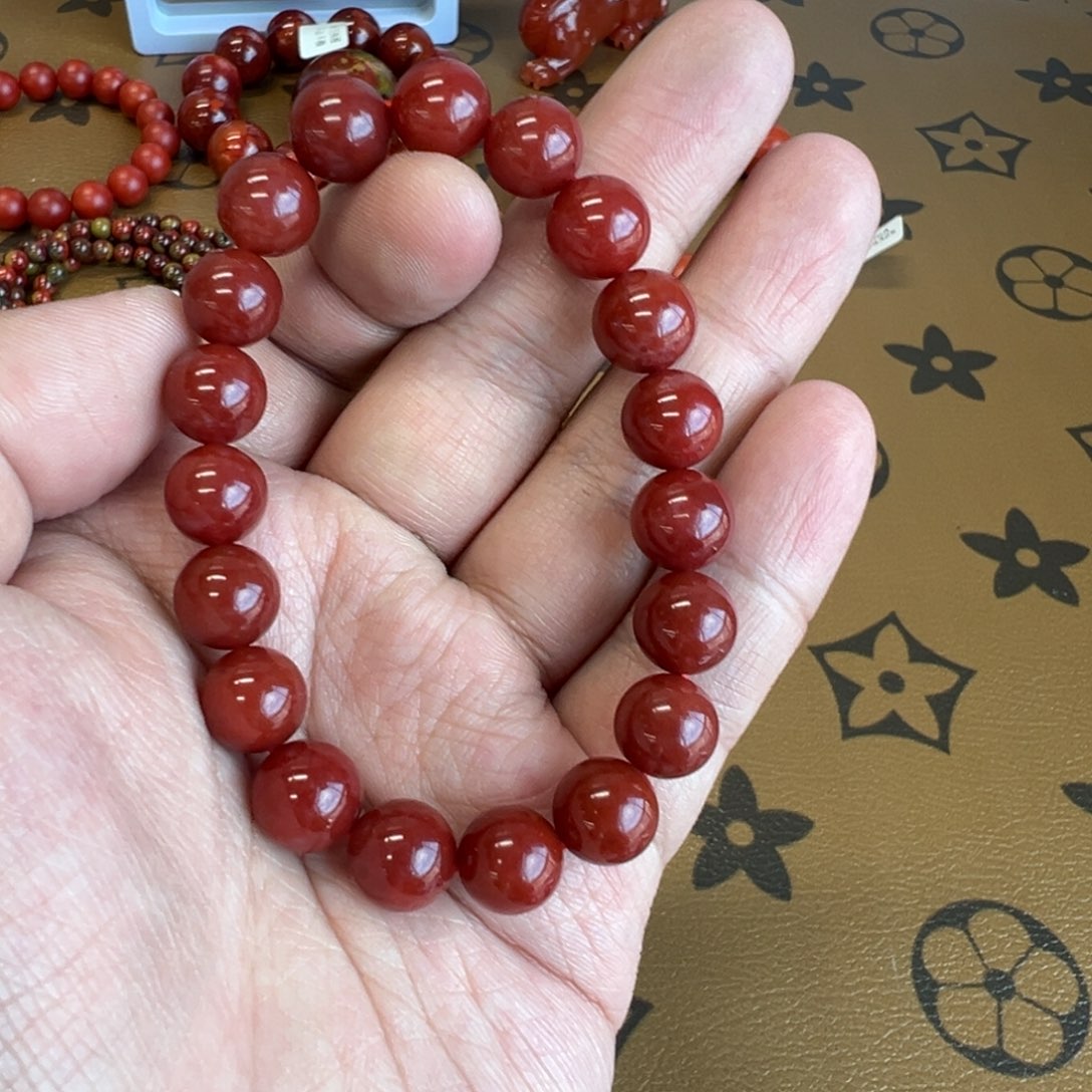 圆***利南红玛瑙未镶嵌手链九口牛血红10mm