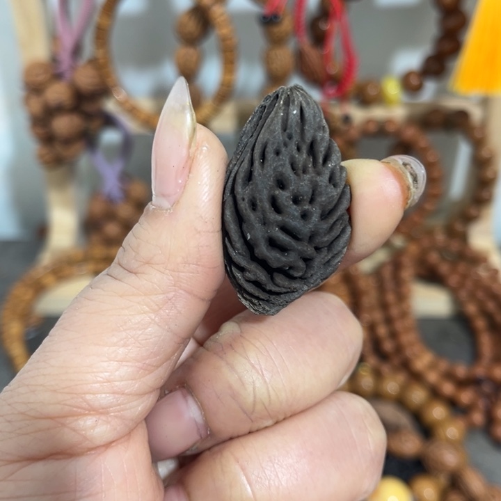 吴***宣野生桃枭黑碳化籽