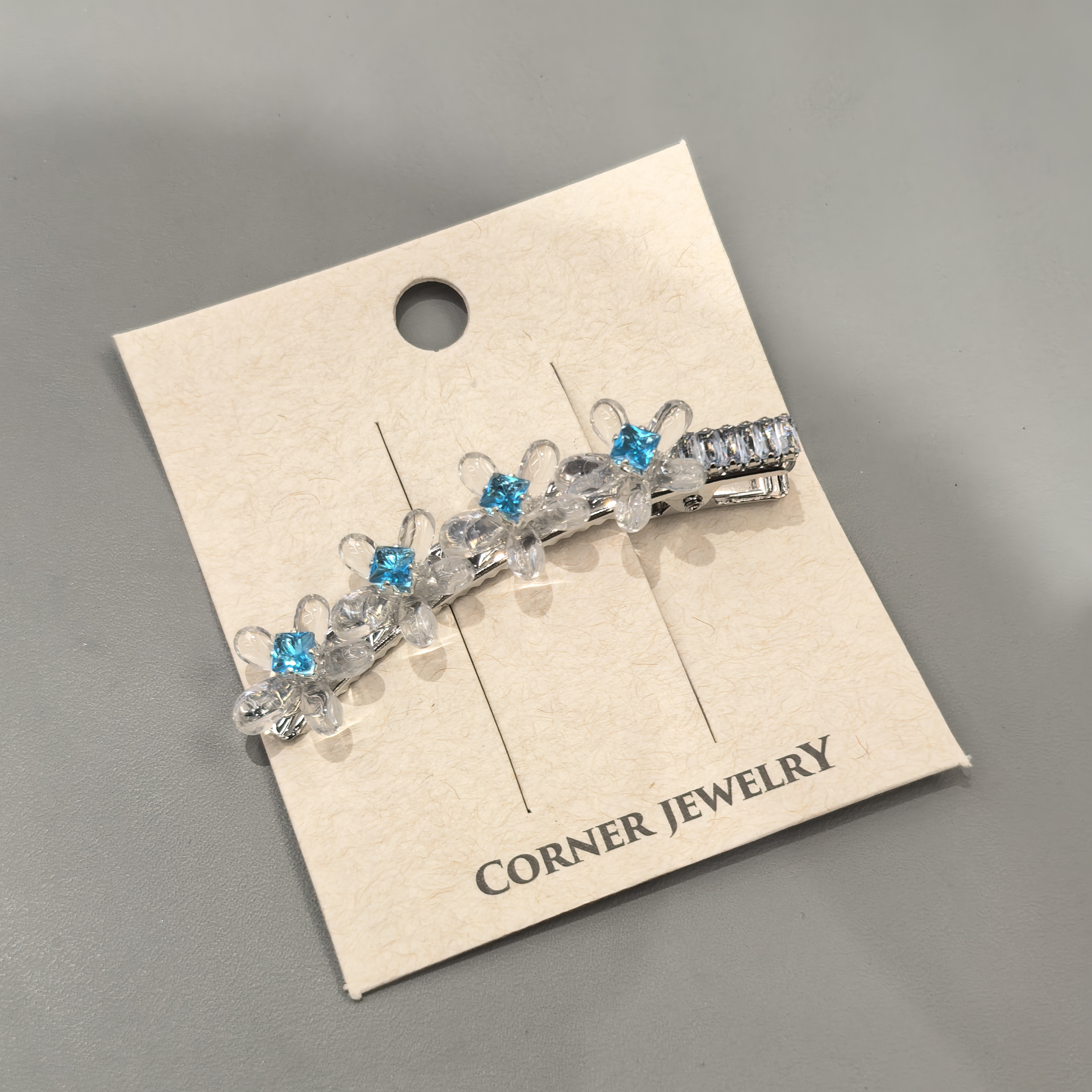 C437蓝色冰透花花闪闪弯刀边夹