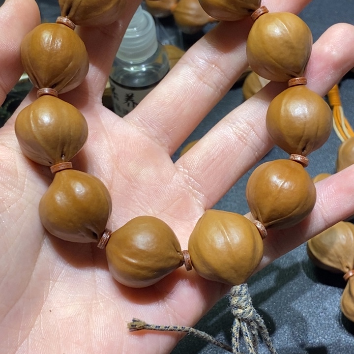 少***头橄榄核吊坠梅林铁核