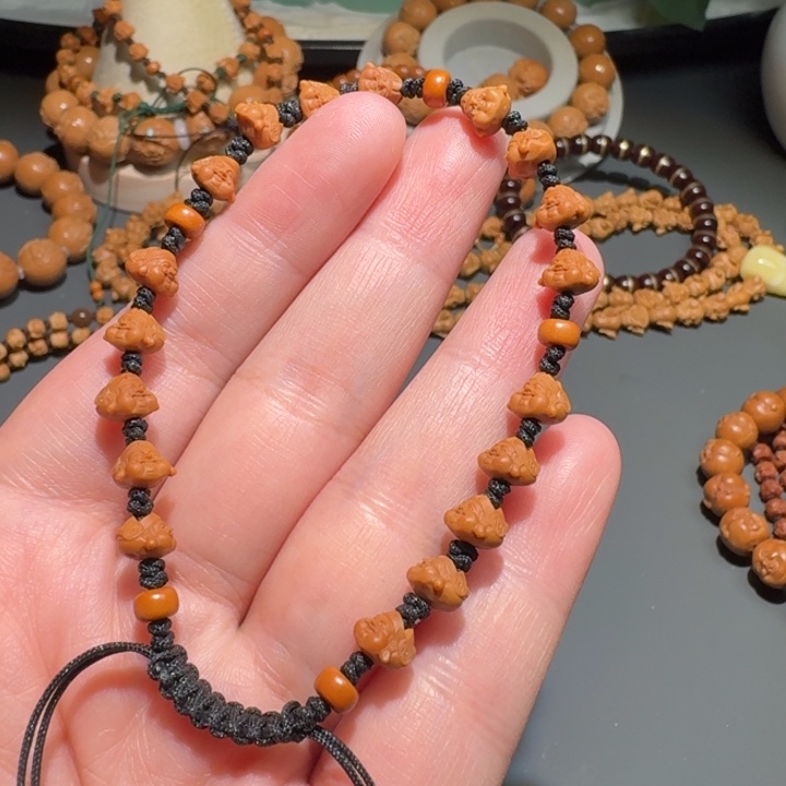 橄榄核手串我***猪核尖财神