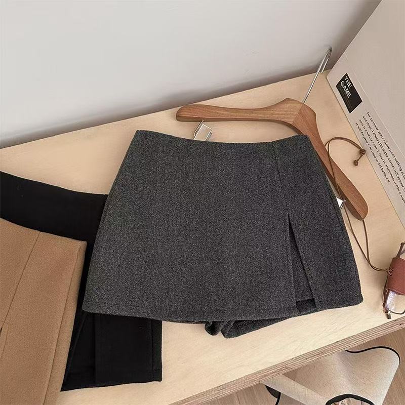 秋冬毛呢A字短裙女时尚设计感2025不规则高腰显瘦开叉短裙学院风