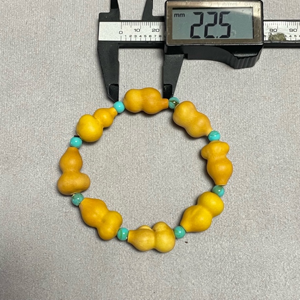 收藏级财包草里金葫芦手串，几万颗难出一串，尺寸看图，7+1颗背籽