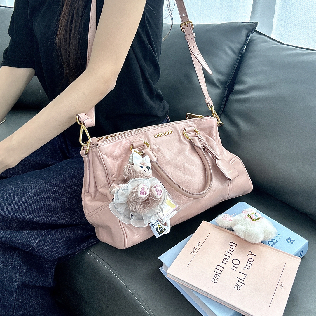 95新 MIU MIU/缪缪 藕粉油蜡皮手提斜挎包
