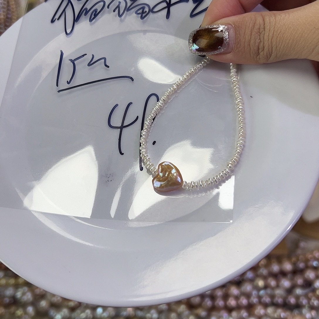 猪***宝淡水珍珠手绳钛钢