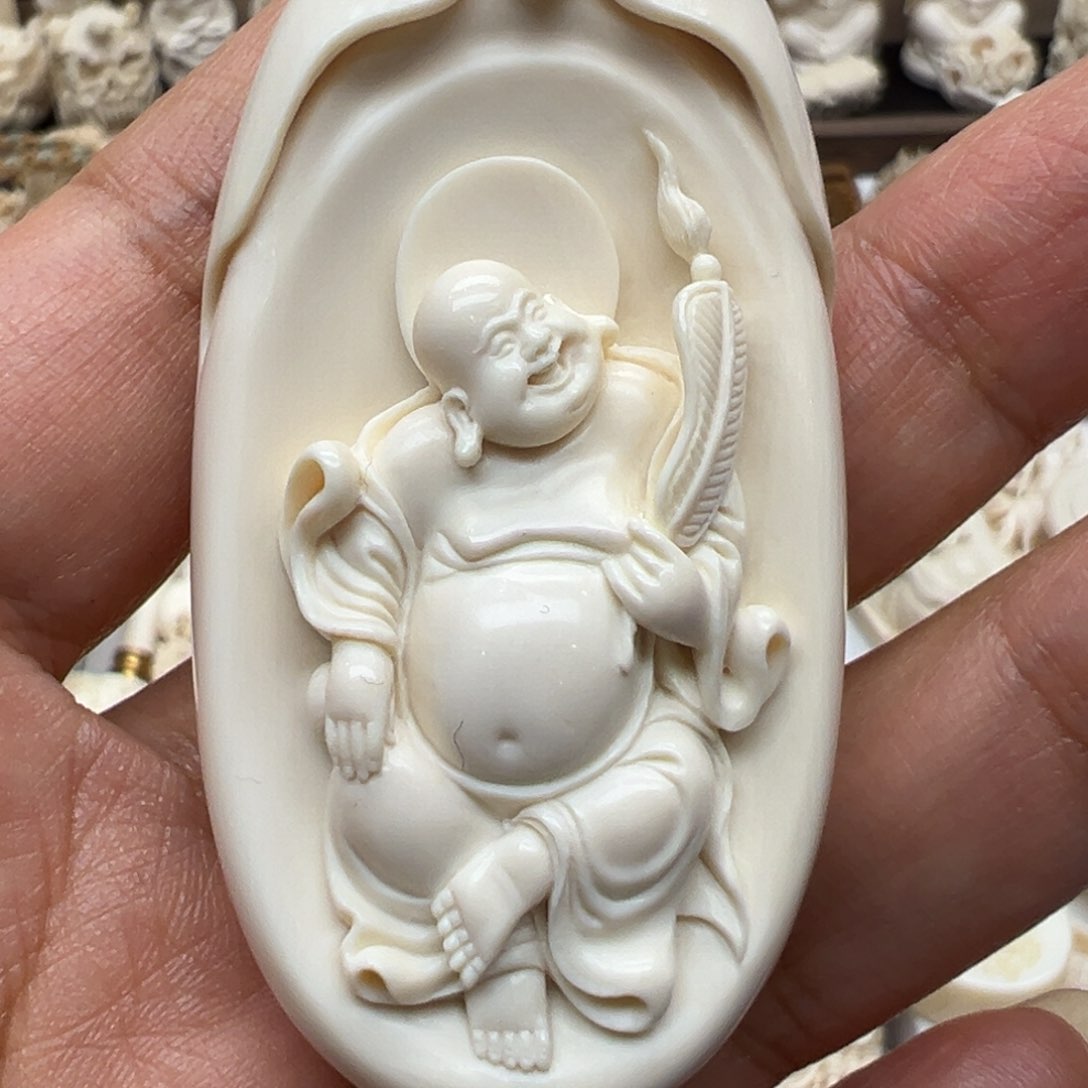 白玉菩提吊坠往**风猛犸