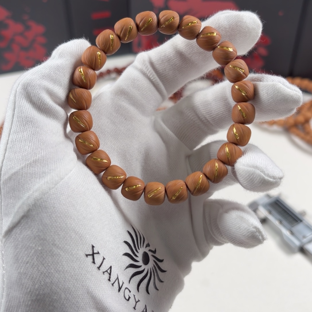 海***.猴头核桃手串鎏金云痕