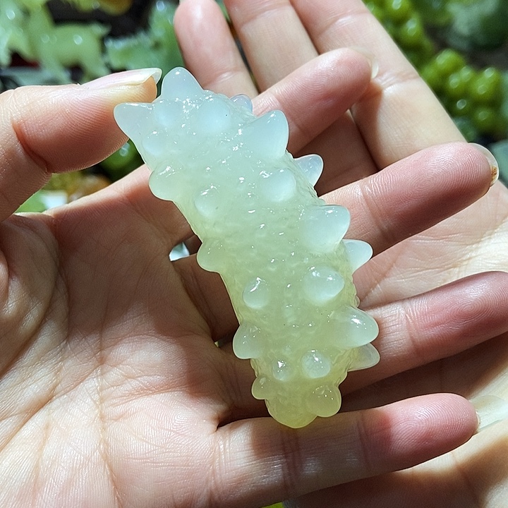 蛇纹石玉手把件合金