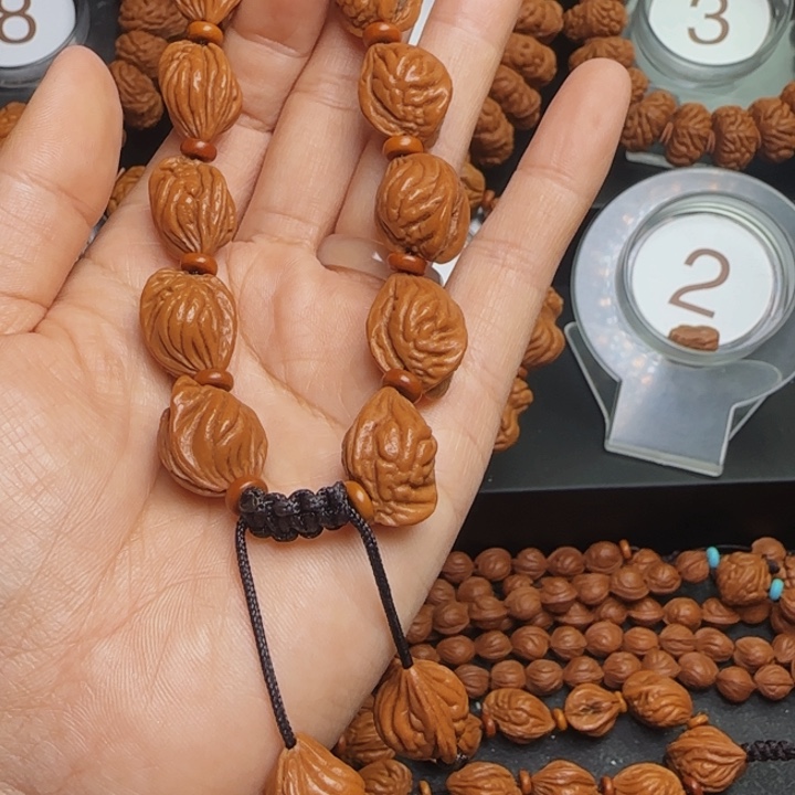 莽***鱼桃核手串龙纹桃核