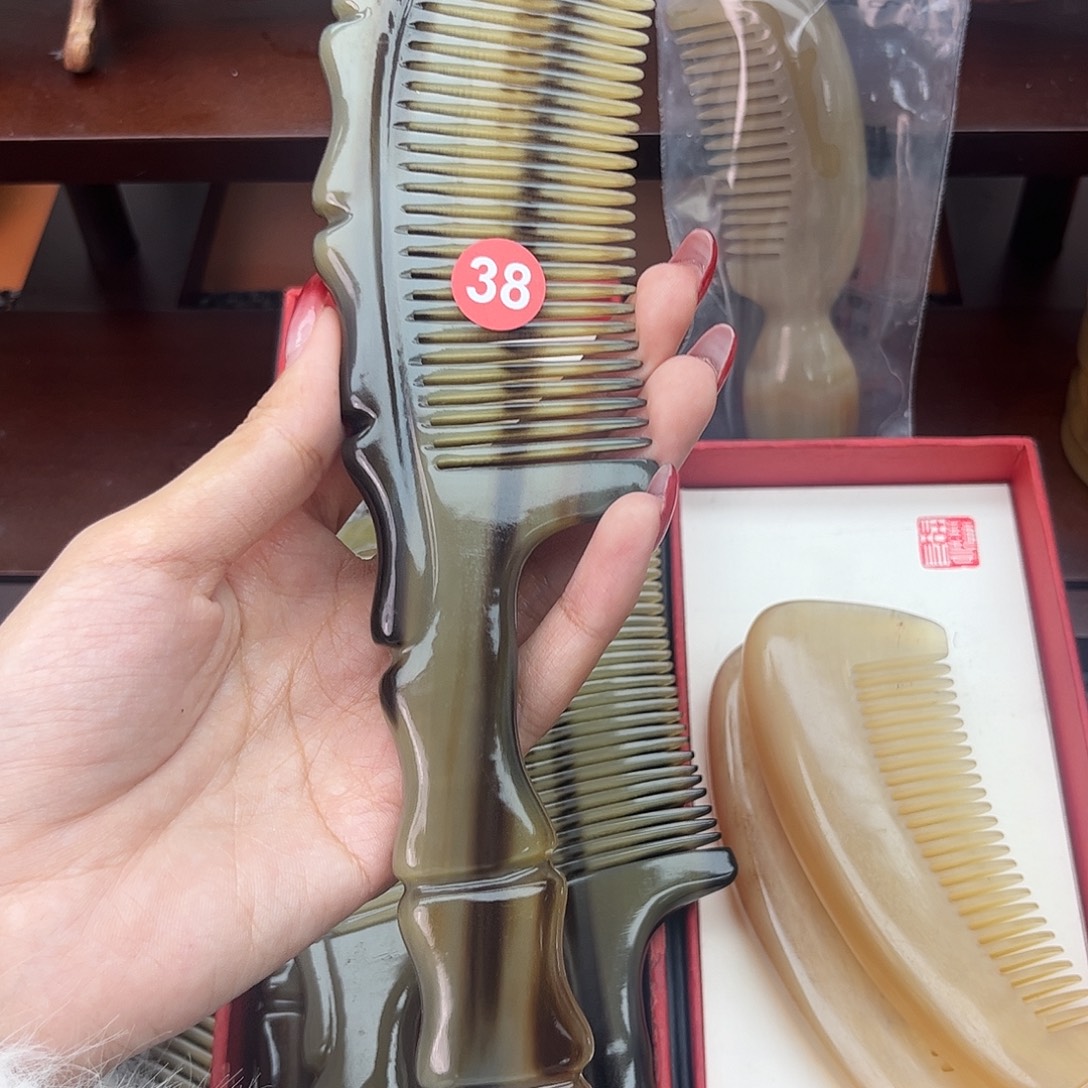 对***纯手工制作纯牛角梳子
