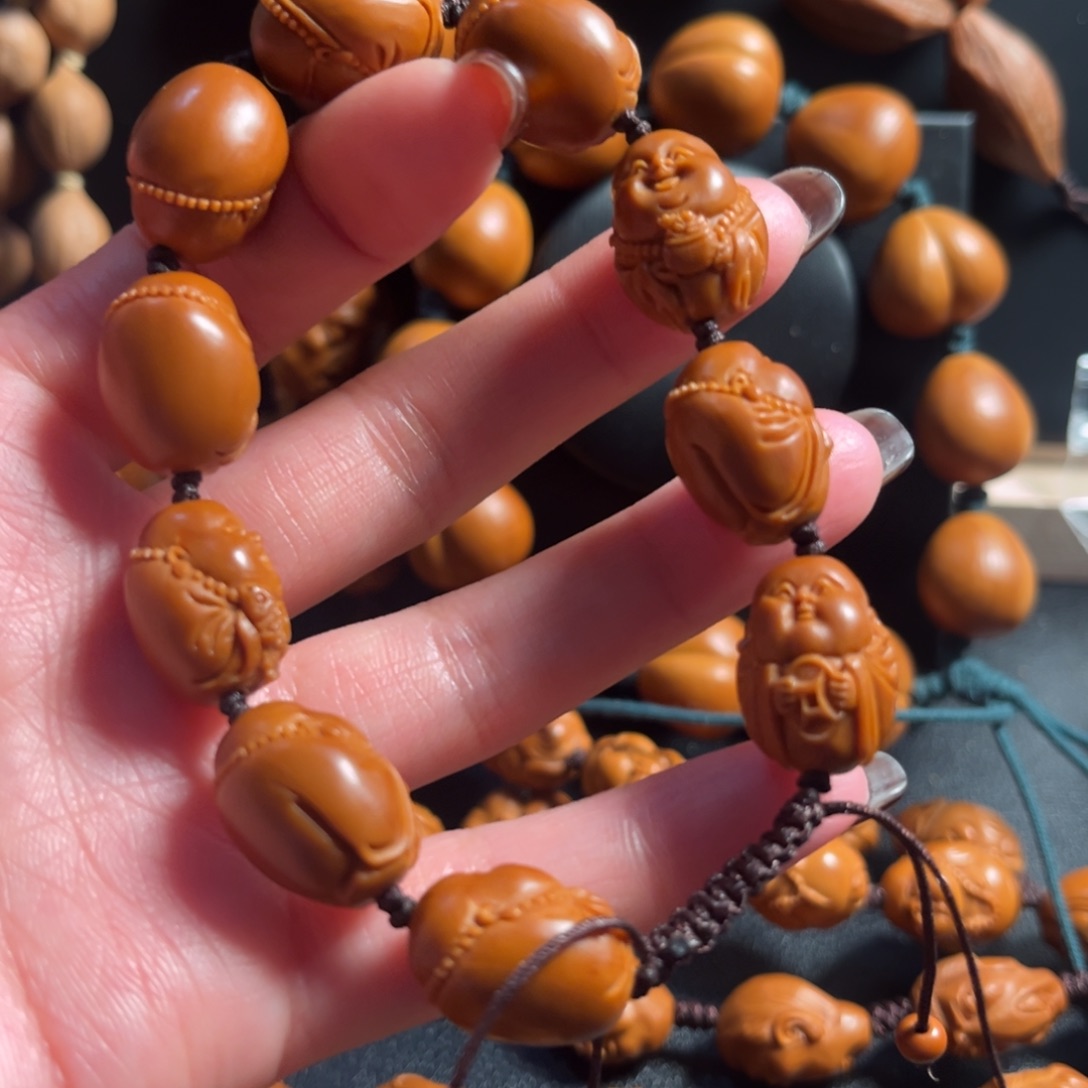 建***功橄榄核吊坠米勒145