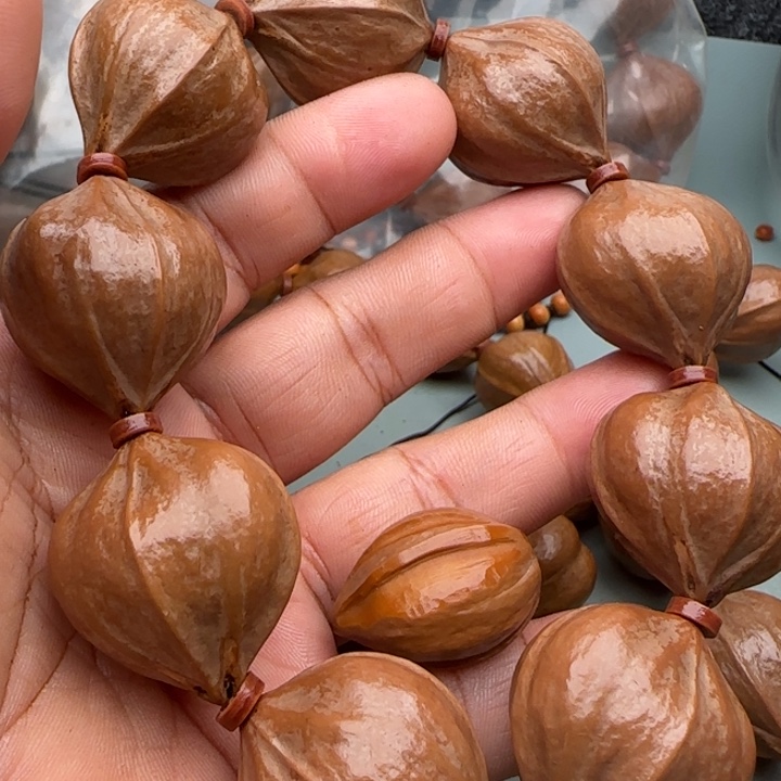 某***＊橄榄核手串橄榄核原皮铁核四花