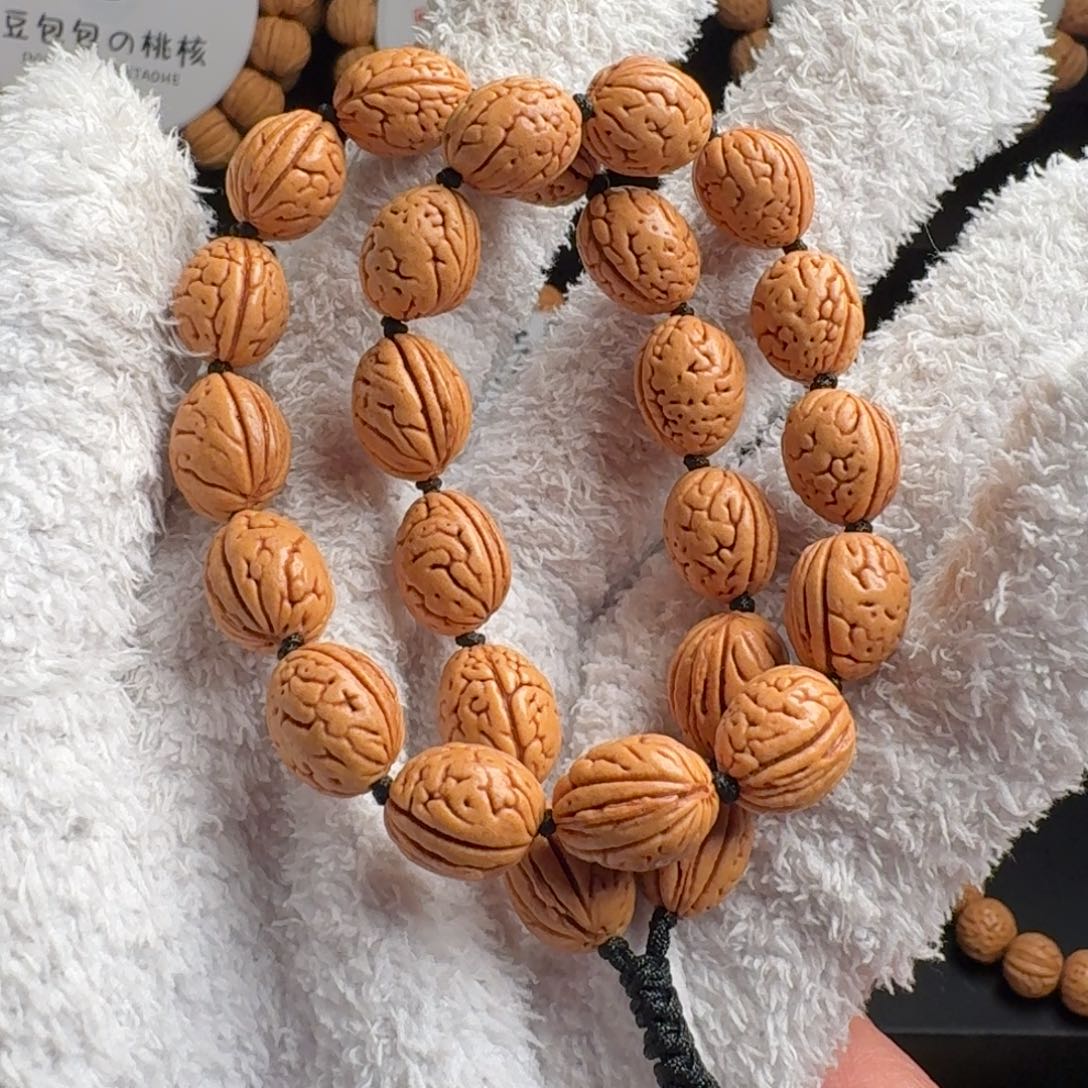 桃核吊坠10+东北野生小钱袋