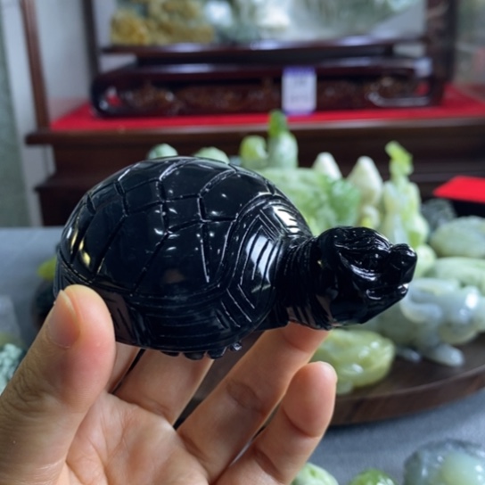 蛇纹石玉手把件未镶嵌风****?