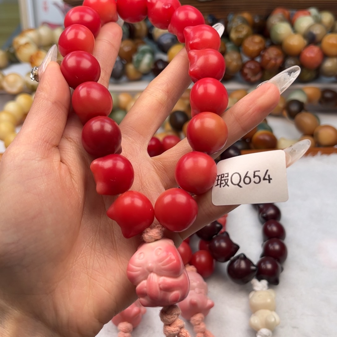 菩提根/象牙果手串橙*17mm瑕猫头手持一串q654