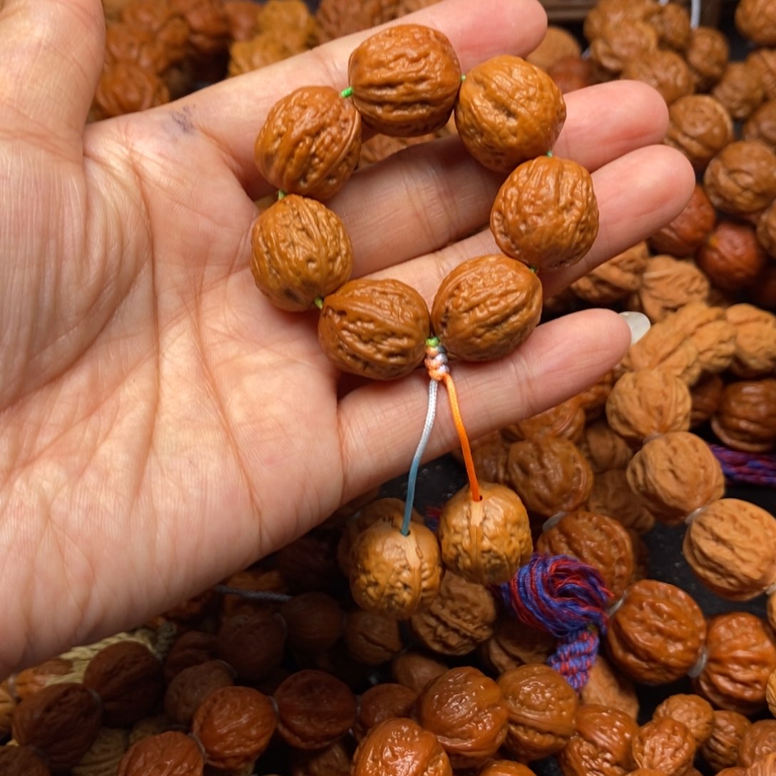 桃核手串小八棱绕指柔