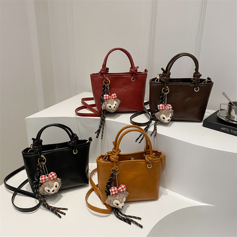 简约时尚手提包2024冬季新款复古质感水桶包纯色通勤单肩斜挎包包