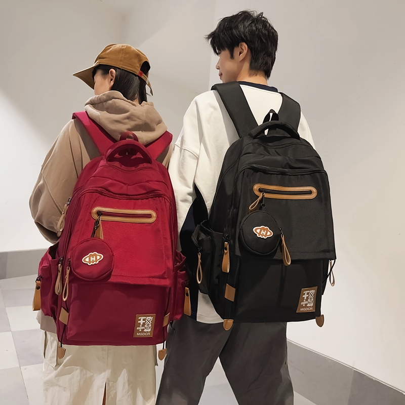 减负护脊气垫书包男初中生大容量高中女生轻便双肩包潮酷百搭背包