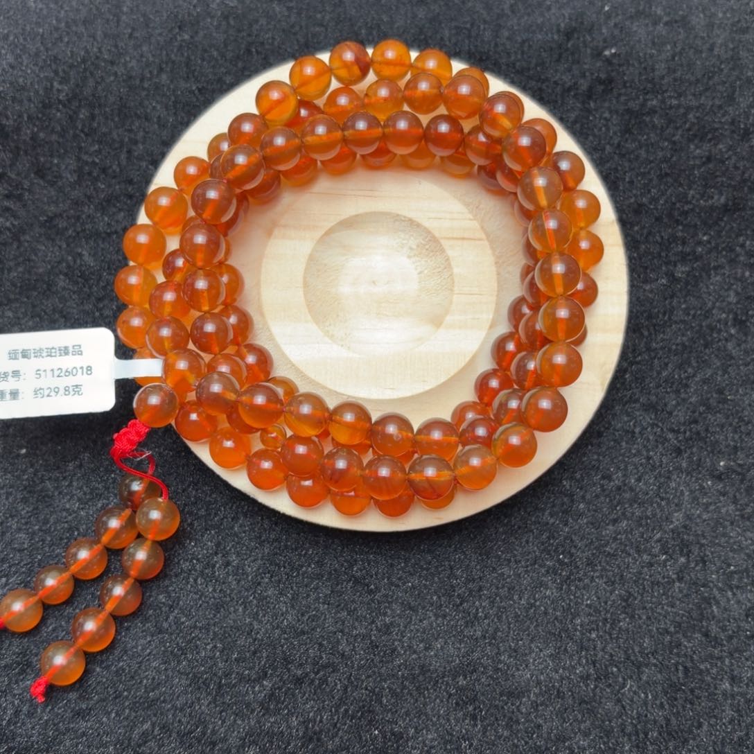 琥珀未镶嵌珠宝奇石7.8mm金蓝底橘红蜜