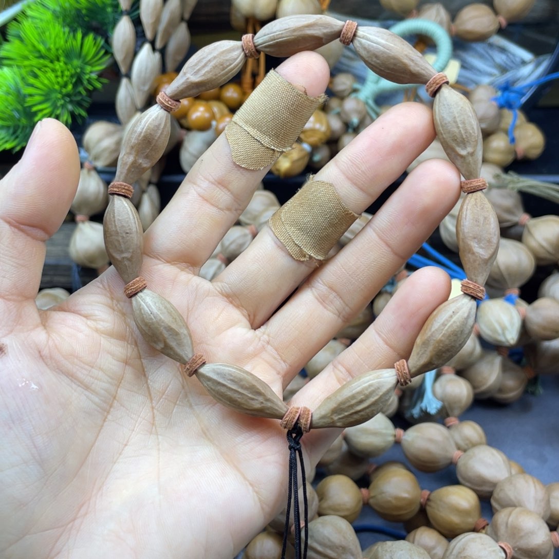 季***笙橄榄核吊坠小尺原皮