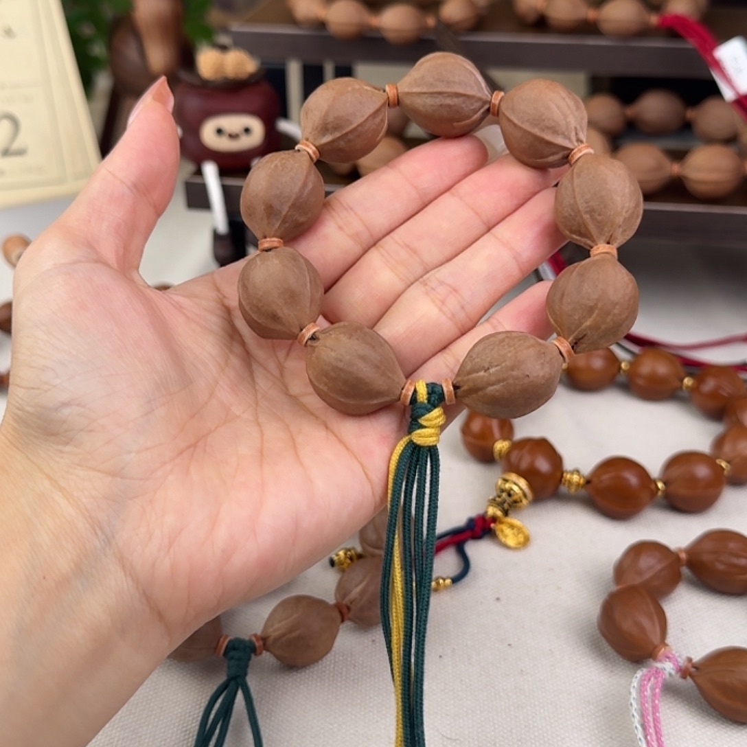 楠***手串橄榄核20*26三花核串