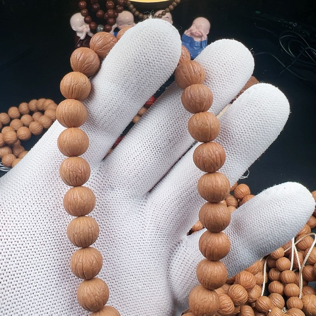 俗***人猴头核桃手串凤羽