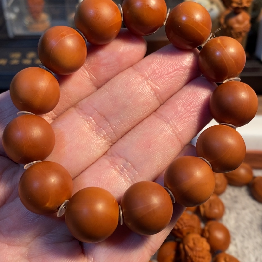 叁***倪手串橄榄核1.7全品水晶核四花正圆光珠