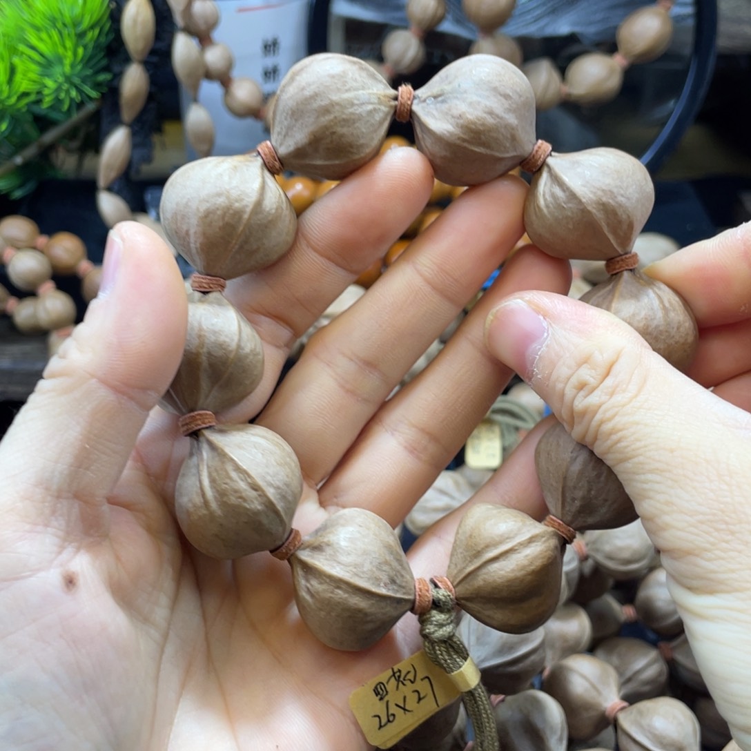 用***5吊坠橄榄核2627四花