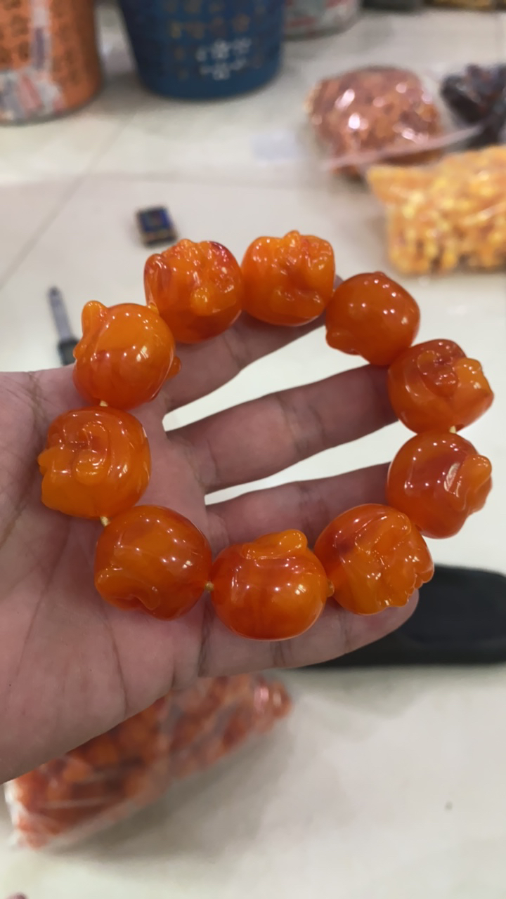 D 770   橘子蜜佛头手串