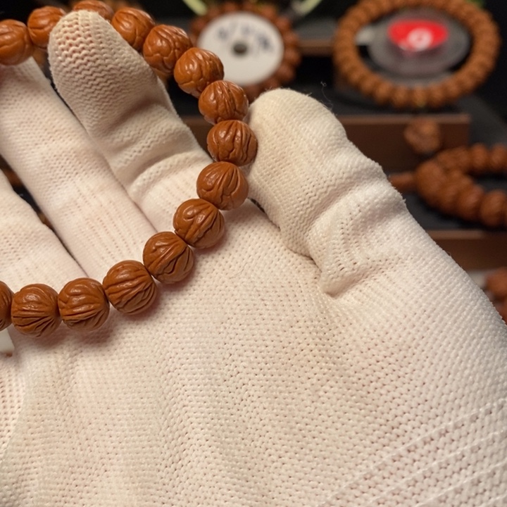 桃核吊坠习**你秦岭龙纹