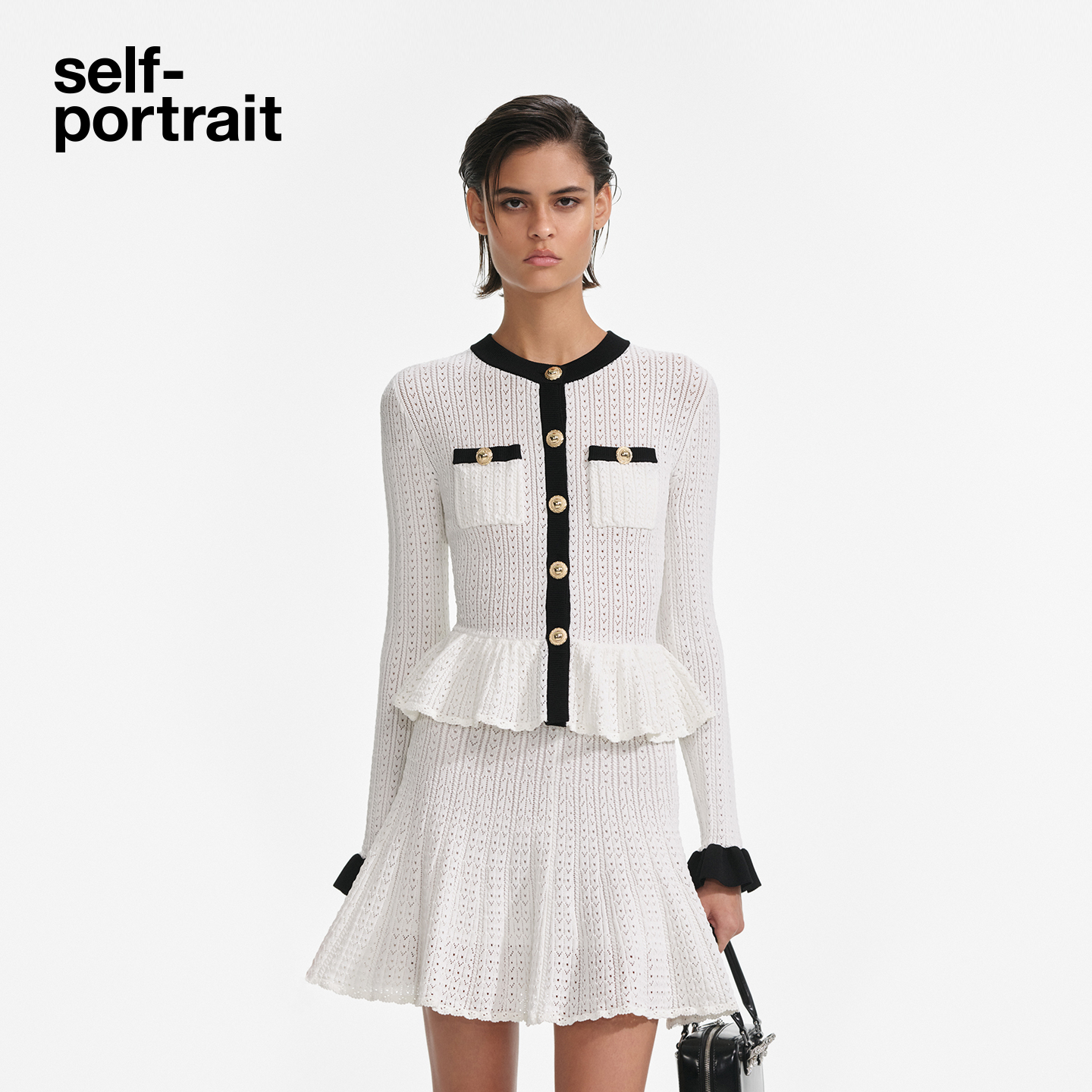 self-portrait 2025早秋新款白撞黑气质通勤长袖镂空针织连衣裙