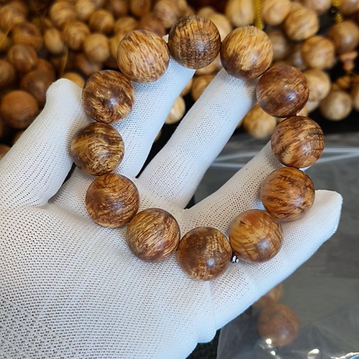 雨***默非洲檀香无事牌琥珀木手串