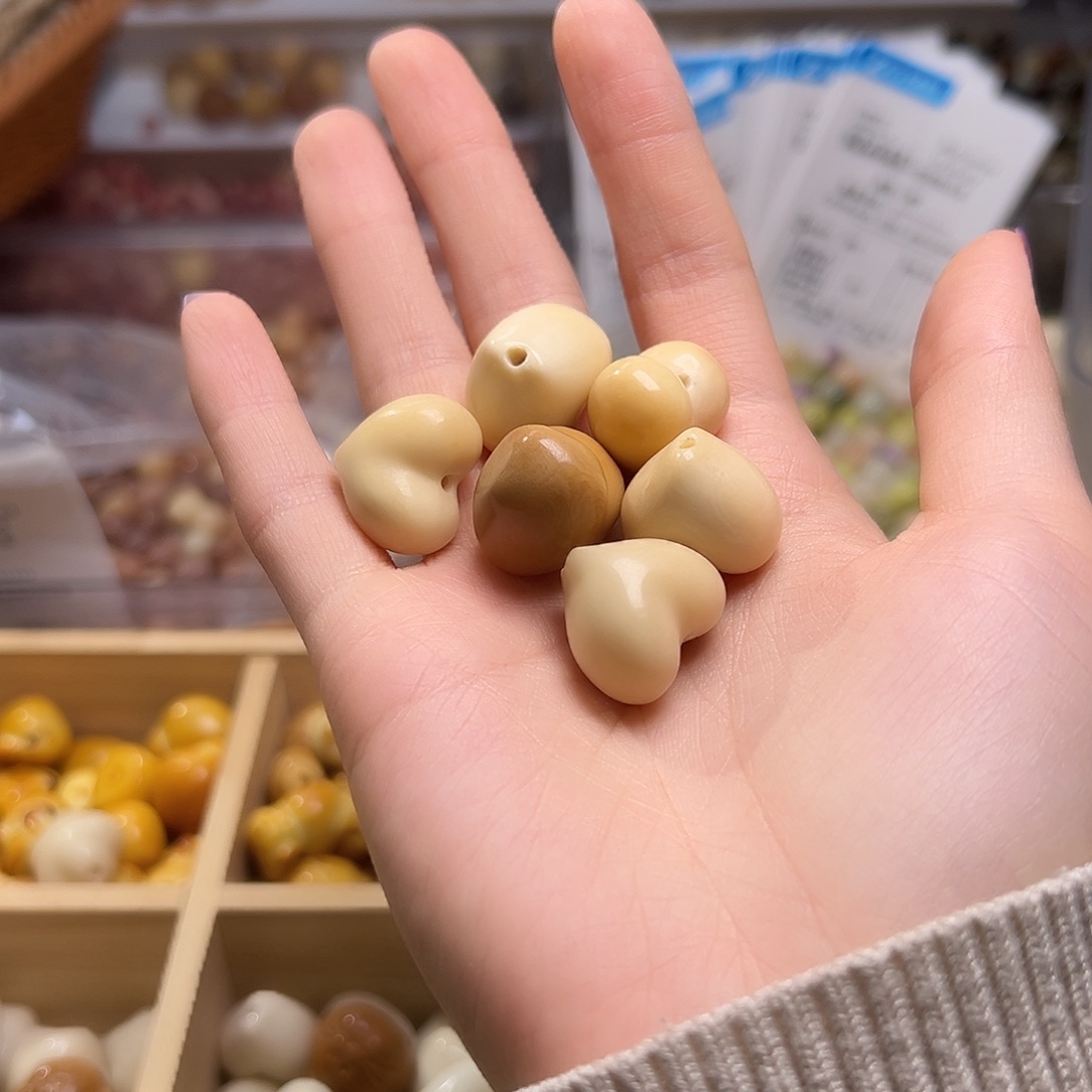 菩提根/象牙果吊坠暖***光爱心7颗瑕疵有裂