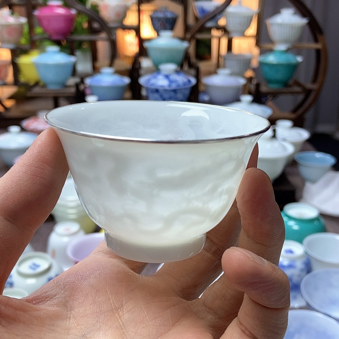 Q*U微瑕脱胎瓷高温手工超薄胎内模印暗刻四海游龙主人杯包银口