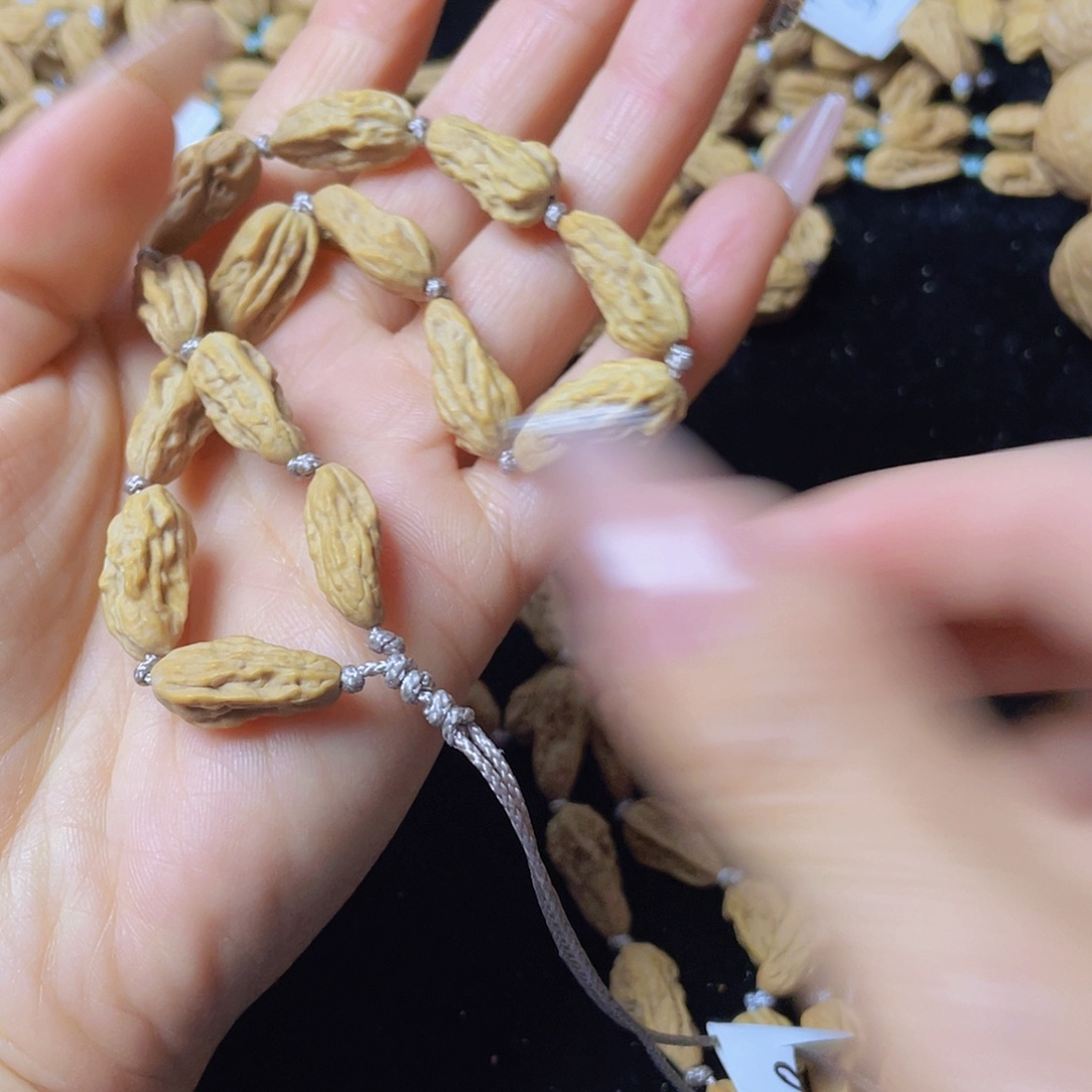 舒***丸吊坠文玩核桃手串