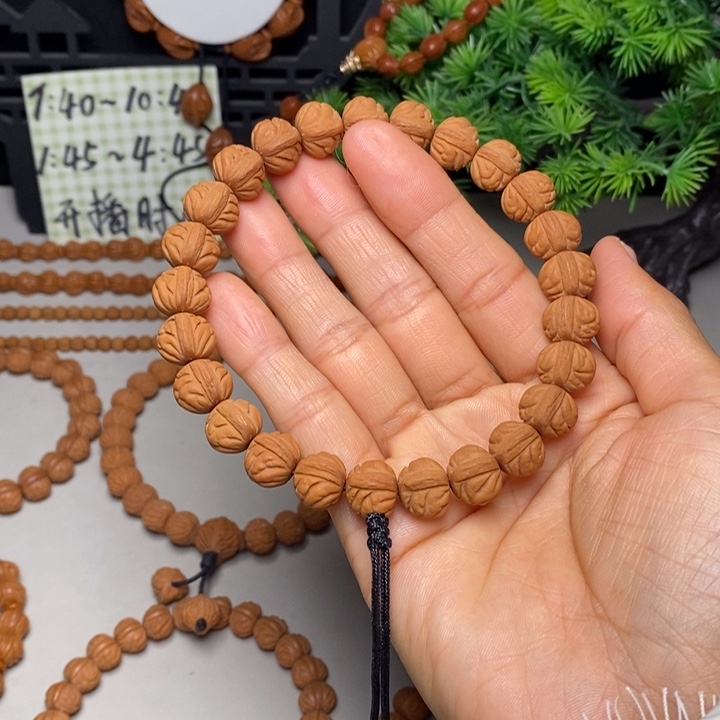 昆***手串桃核凤羽手持