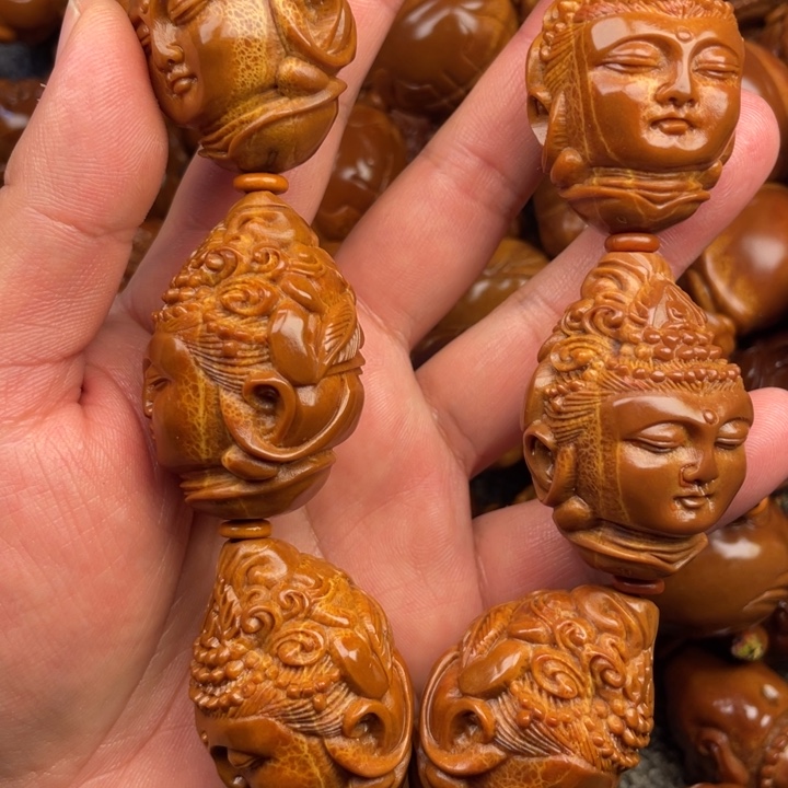 橄榄核吊坠肖****司橄榄核手持