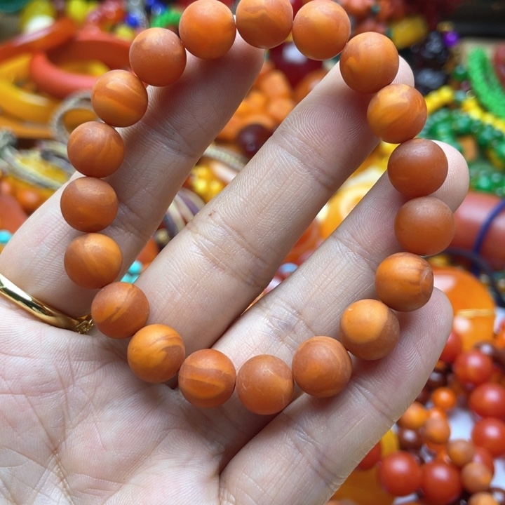 树脂制品83号橘色手串